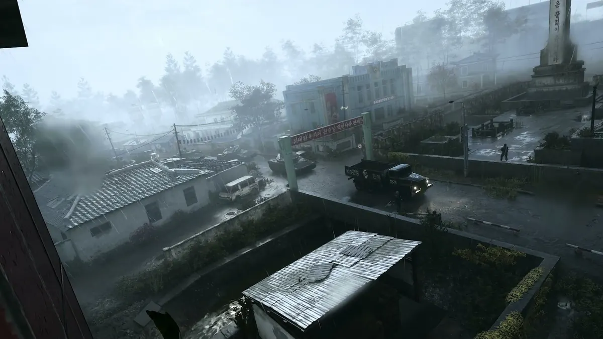 A narrow container lane beside harbor water on the Shipment remake